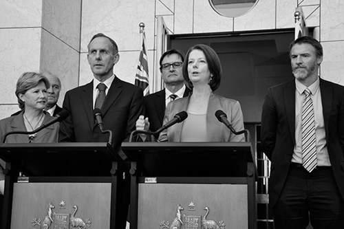 Former Prime Minister Julia Gillard giving a speech at a lectern